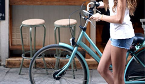 girl with bike alongside